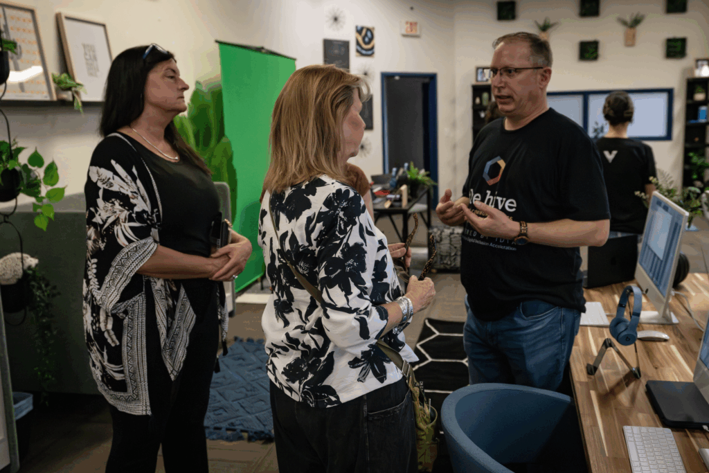 A digital navigator speaking with attendees