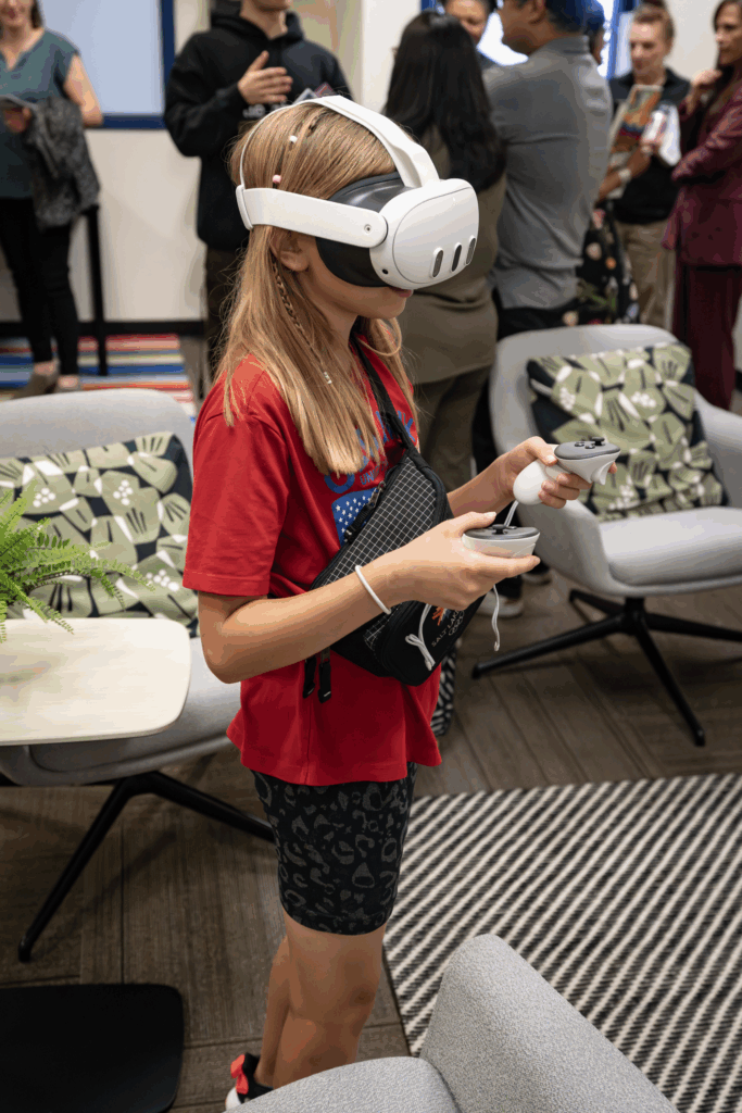 a young girl explores virtual reality a the Hive