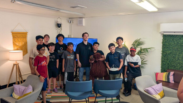 Full group photo of the campers and Digital Navigators posing together and smiling