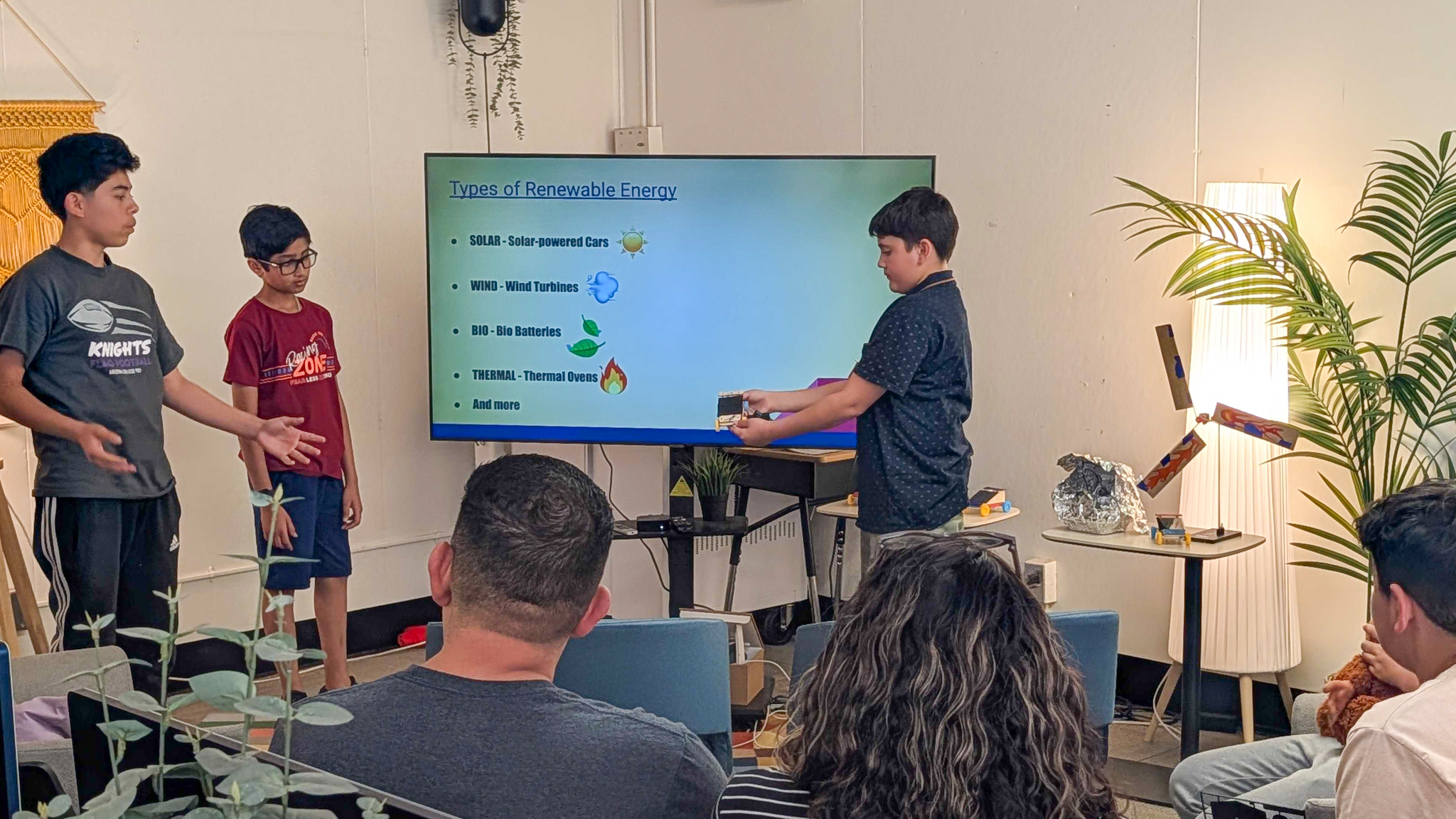 Close up of camper presenting his project